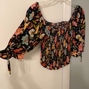 Smocked floral top with puff sleeves